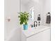 Modern bathroom with white vanity, black matte fixtures, and a small plant at 1511 Malta Ave, Raleigh, NC 27610