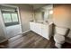Elegant bathroom with double vanity, granite countertop, and updated fixtures at 223 Bonsai Way, Four Oaks, NC 27524