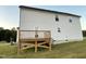 Well-maintained house with a wooden deck and a green lawn at 223 Bonsai Way, Four Oaks, NC 27524