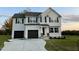 Two story home with a two car garage and landscaped yard at 223 Bonsai Way, Four Oaks, NC 27524