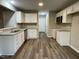 Kitchen with white cabinets and granite countertops at 223 Bonsai Way, Four Oaks, NC 27524