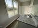 Clean bathroom with granite vanity and a large window at 223 Bonsai Way, Four Oaks, NC 27524