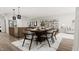 Bright dining area with wooden table and chairs, adjacent to kitchen and living room at 4046 Elk Creek Ln # 62, Raleigh, NC 27612