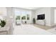Bright living room features large windows and hardwood floors at 4046 Elk Creek Ln # 62, Raleigh, NC 27612