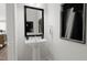 Elegant bathroom with pedestal sink, mirror, and modern decor at 4046 Elk Creek Ln # 62, Raleigh, NC 27612