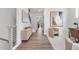 Modern hallway with light wood floors and stylish artwork at 4047 Elk Creek Ln # 13, Raleigh, NC 27612