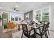 Open living room with gray shiplap wall, comfortable sectional sofa, and access to backyard at 4047 Elk Creek Ln # 13, Raleigh, NC 27612