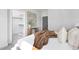 Bright bedroom with a walk-in closet and cozy bedding at 4047 Elk Creek Ln # 13, Raleigh, NC 27612
