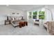 Main bedroom with a king bed, sitting area, and lots of natural light at 4047 Elk Creek Ln # 13, Raleigh, NC 27612