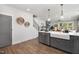Modern kitchen island with farmhouse sink and gray cabinets at 4047 Elk Creek Ln # 13, Raleigh, NC 27612