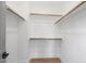 Bright walk-in closet with ample shelving and hanging rods at 4047 Elk Creek Ln # 13, Raleigh, NC 27612