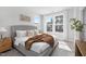 Spacious bedroom with large windows and plush bedding at 4047 Elk Creek Ln # 13, Raleigh, NC 27612