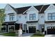 Modern three-unit townhome building with attached garages at 4047 Elk Creek Ln # 13, Raleigh, NC 27612