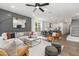 Open concept living space with sectional sofa, dining area, and kitchen view at 4047 Elk Creek Ln # 13, Raleigh, NC 27612