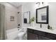 Bathroom with tub, shower, dark vanity, and patterned tile floor at 4047 Elk Creek Ln # 13, Raleigh, NC 27612