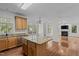 Spacious kitchen featuring granite countertops, stainless steel appliances, and hardwood floors at 2 Piney Ridge Ct, Durham, NC 27712