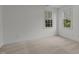 Spacious bedroom with two windows and carpet at 2 Piney Ridge Ct, Durham, NC 27712