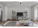 Living room with built-in shelving and hardwood floors at 104 Vallco Ln, Durham, NC 27713