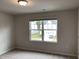 Bright bedroom featuring a large window and neutral decor at 4305 Olde Waverly Way, Fuquay Varina, NC 27526