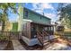 Green house exterior with screened porch and patio at 5004 Royal Troon Dr, Raleigh, NC 27604