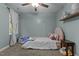 bedroom with single bed, window, and shelving at 5004 Royal Troon Dr, Raleigh, NC 27604