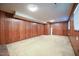 Finished basement recreation room with wood paneling at 3109 Edgetone Dr, Raleigh, NC 27604