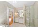 Bathroom with granite countertop, white vanity, and glass shower at 621 Sugarberry Rd, Chapel Hill, NC 27514