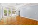 Bright bedroom with hardwood floors and access to a private balcony at 621 Sugarberry Rd, Chapel Hill, NC 27514