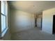 Unfinished bedroom with window and door to hallway at 77 Frasier Fir Way, Lillington, NC 27546