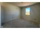 Simple bedroom with one window and unfinished flooring at 77 Frasier Fir Way, Lillington, NC 27546