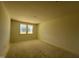 Unfinished bedroom with neutral walls and a double window at 77 Frasier Fir Way, Lillington, NC 27546