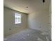 Unfinished bedroom with window and closet at 77 Frasier Fir Way, Lillington, NC 27546