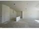 Spacious living room with high ceilings and large windows at 77 Frasier Fir Way, Lillington, NC 27546