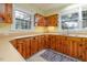 Kitchen with wood cabinets, double sink, and ample counter space at 230 Chavasse Ave, Henderson, NC 27536