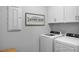 Convenient laundry room with washer, dryer, and cabinets at 5013 Trotter Dr, Raleigh, NC 27603