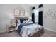 Charming bedroom with a whimsical cloud theme and navy accents at 5013 Trotter Dr, Raleigh, NC 27603