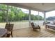 Relaxing screened porch overlooking a wooded backyard at 5013 Trotter Dr, Raleigh, NC 27603