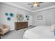 Main bedroom with a dresser, chair and large windows at 5013 Trotter Dr, Raleigh, NC 27603