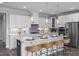 Modern kitchen with white cabinets, large island, and stainless steel appliances at 5013 Trotter Dr, Raleigh, NC 27603