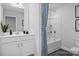 Clean bathroom with a bathtub, shower, and updated vanity at 5013 Trotter Dr, Raleigh, NC 27603