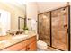 Modern bathroom with granite vanity and large shower at 110 Founders Ridge Dr, Chapel Hill, NC 27517