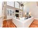 Two-story great room with hardwood floors, built-in shelving, and fireplace at 110 Founders Ridge Dr, Chapel Hill, NC 27517