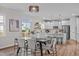 Modern kitchen with island, stainless steel appliances, and white cabinets at 4811 Homeplace Dr, Apex, NC 27539