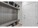 Mudroom with bench, cubbies, and hooks at 4811 Homeplace Dr, Apex, NC 27539