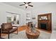 Living room showcasing hardwood floors, a fireplace, and an open floor plan at 1000 Lamond Ave, Durham, NC 27701