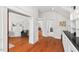 Spacious hallway with hardwood floors and views into other rooms at 1000 Lamond Ave, Durham, NC 27701