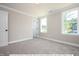 Spacious bedroom with neutral carpeting and large windows at 775 Vick Rd, Spring Hope, NC 27882