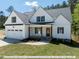 White two-story house with a gray roof and a two car garage at 775 Vick Rd, Spring Hope, NC 27882