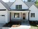 Front view of farmhouse-style home with a porch at 775 Vick Rd, Spring Hope, NC 27882