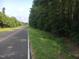 Wooded lot with road frontage, offering privacy and natural beauty at 775 Vick Rd, Spring Hope, NC 27882